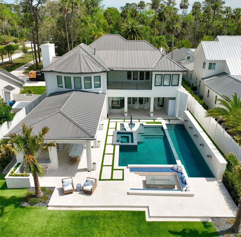 birds eye view of backyard patio with pool deck